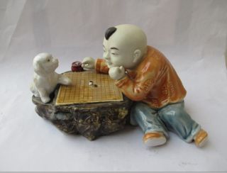 Ancient Color Ceramic Statue Chess Player And Small Animal (dog) photo