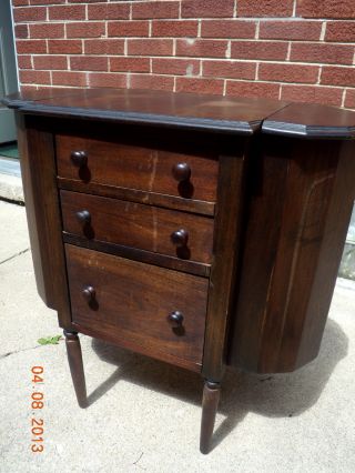 Antique Sewing Cabinet In Oak Wood. photo