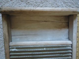 Antique Brass Laundry Scrub Board That Shows Heavy Use photo