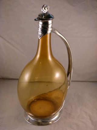A Fine & Rare Liberty & Co Tudric Pewter And Glass Decanter By Archibald Knox. photo
