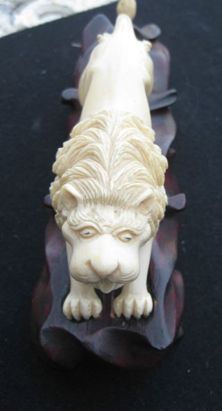 Japanese Carved Faux Ivory Lion On Carved Wooden Base photo