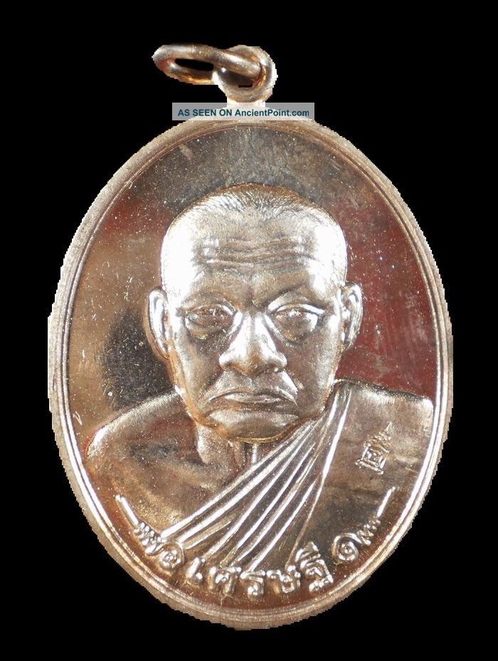 A Coin Inspires The Luck,  Lp Phon,  Wat Nongkem,  Thailand,  Thai Amulet. Amulets photo