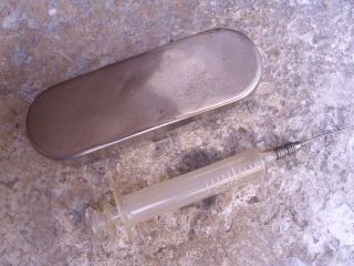 A Vintage French Boxed Glass Syringe In A Stainless Steel Box photo