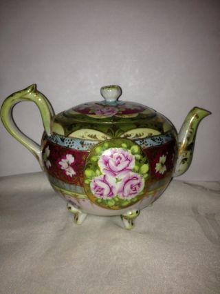 Oriental Floral Footed Teapot With Matching Lid And Gold Inlay photo