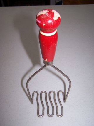 Primitive Antique Vintage Red Painted Wood Handled Metal Twisted Potato Masher photo