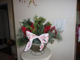 Primitive Christmas Floral Arrangement In Old Wire Colander photo