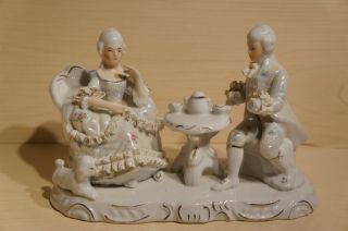 Vintage Porcelain Figurines Victorian Couple Having Tea photo