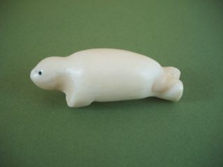 Seal 2.  Antique Inuit Carving Of Traditional Material. photo