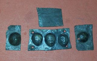 Bronze Plate Showing Faces Roman Period photo