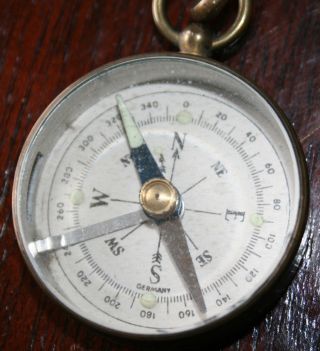 Vintage German Brass Compass With Leather Buttonhole Strap. photo