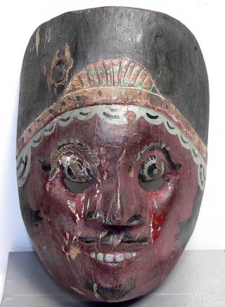 Old Wayang Mask Topeng Wajang Keris Tribe Art Indonesia photo