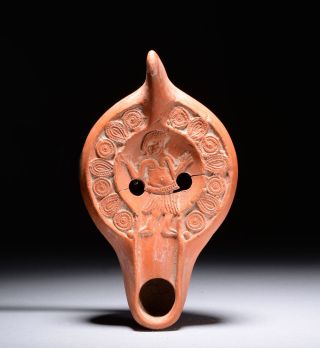 Ancient Roman Pottery Oil Lamp With Entertainer Dancing Scene - 200 Ad photo