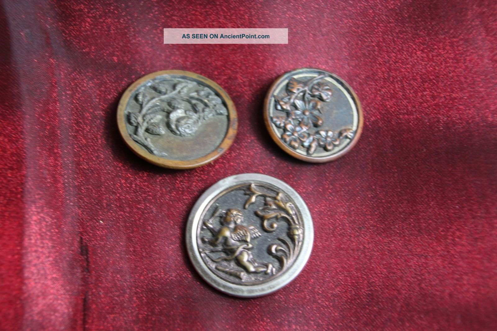 3 Victorian Brass Buttons With Flowers And A Cupid Buttons photo