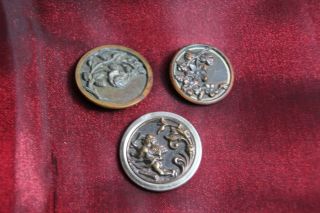3 Victorian Brass Buttons With Flowers And A Cupid photo