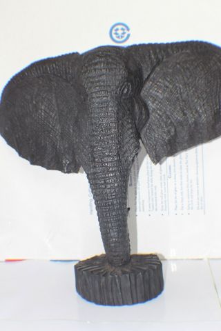 An Authentic Kenyan Sculpture Tribal Art Elephant Standing Head Real Texture photo