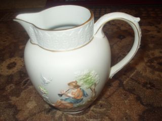 Antique Pitcher With Hand Painted Embossed Scenes photo