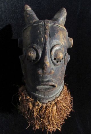 West African Tribal Mask - Ivory Coast - Dan People - Horns,  Round Eyes,  Fringe photo