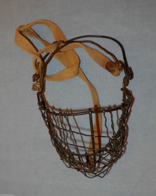 Old Ranch Or Farm Primitive Calf Weaner In Metal Wire With Strap photo