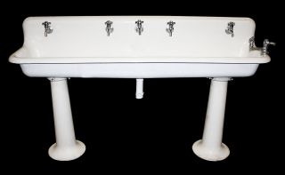 Industrial Porcelain Gang Sink On Pedestal Legs photo