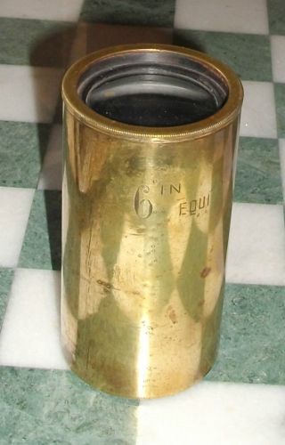 An Antique Brass Cylinder With Lens At Either End Stamped 6 In Equi. photo