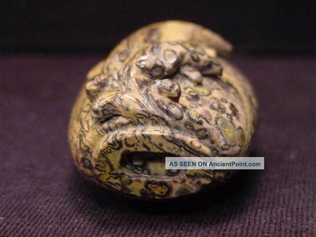 Chinese Carved Tiger Skin Rock Snuff Bottle Dolphins - Brass Spoon Snuff Bottles photo