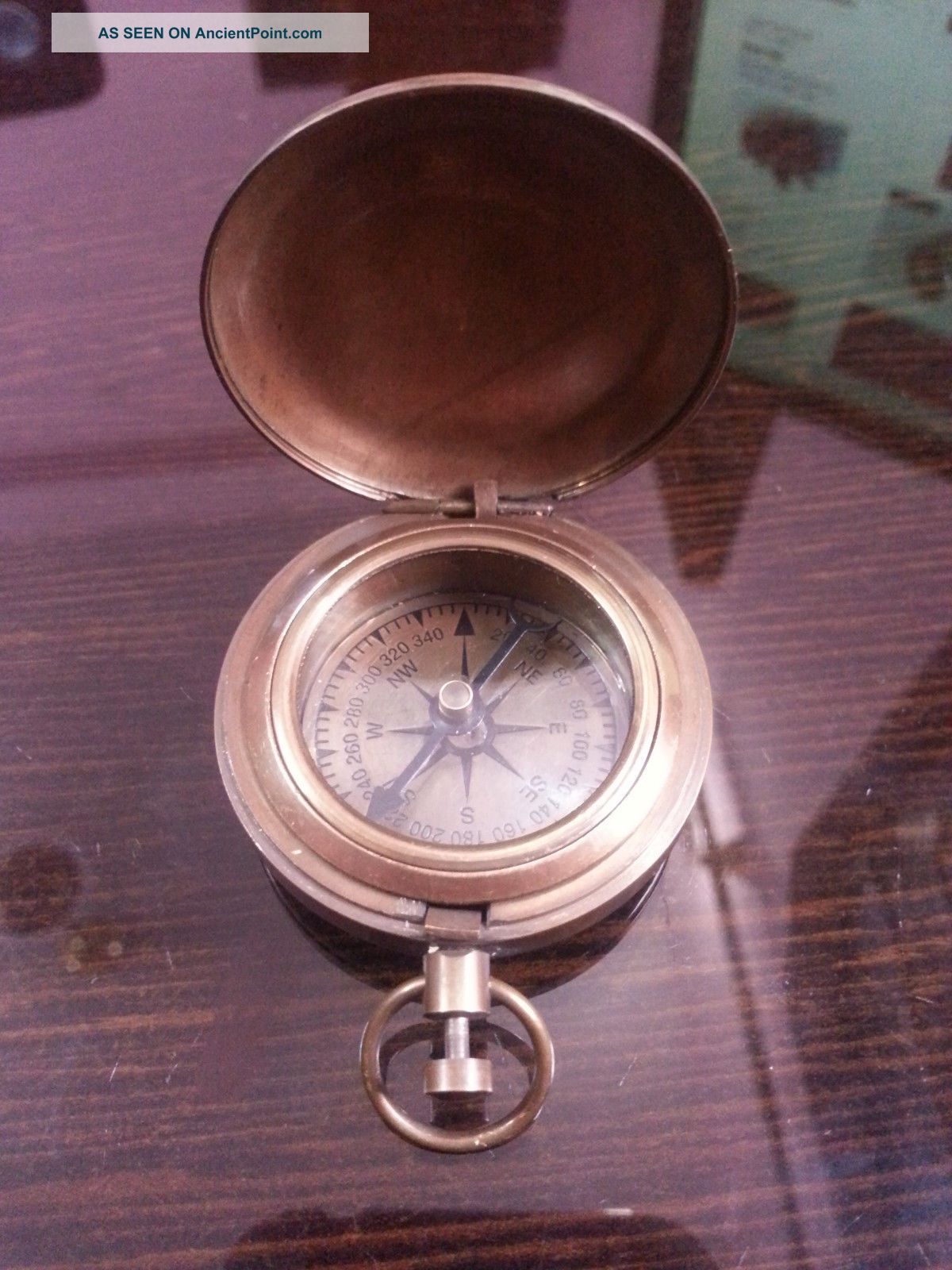 18th Century Style Nautical Compass Push Button Directional Compass In Antique. Compasses photo