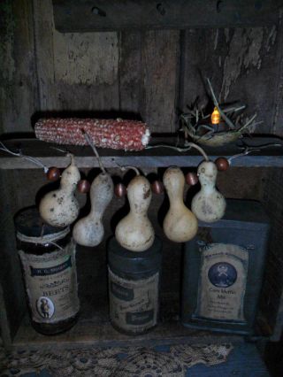 Primitive Early Look Cupboard - Gourd Garland & Light - Old Box W/tins & Bottle photo