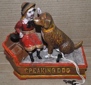 A Rare And Attractive Speaking Dog Piggy Bank With A Doll photo