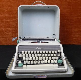 Vintage 1960s Olympia Deluxe Portable Typewriter photo