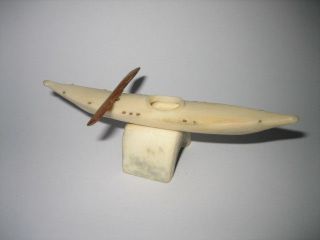 A Vintage Finely Carved Miniature Inuit Eskimo Bovine Bone Kayak And Stand photo