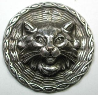 Antique Button Detailed Dimensional Cat Face On Wicker Background photo