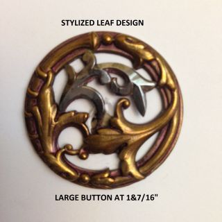 Striking Old Button; A Stylized Leaf Design In Stamped Brass W/ A Polished Steel photo
