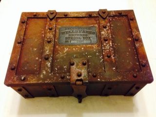 Reproduction Wells Fargo Strong Box - Safe With Metal Tag Numbered 284 photo