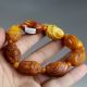 Chinese Hand - Carved Buddha Head Artificial Beeswax Bracelets 1993 Bracelets photo 1