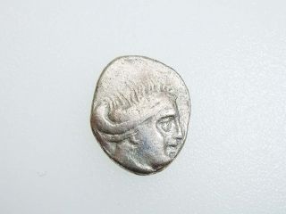 A955.  Greek Silver Coin Obol photo