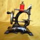 Antique Victorian Cast Iron Small Toy Sewing Machine With Golden Decorations. Sewing Machines photo 1
