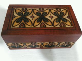 Small Carved Box Decorated With Plants photo