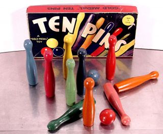 Art Deco Gold Medal Toy Ten Pins Bowling Ball Game Graphics And Colors photo