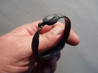 Ancient Roman Bronze Bracelet,  In Form Of Snake Holding Her Tail In The Mouth photo