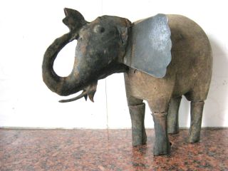 Antique Elephant Door Stop.  Iron And Wood. photo