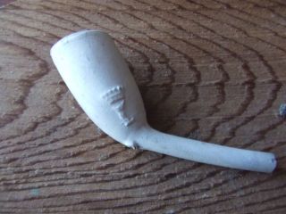 A Clay Pipe With Decoration.  18th Century A River Thames Find. photo
