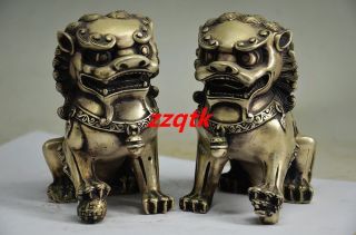 A Pair Old Chinese Silver Carved Guard Lion Statues photo