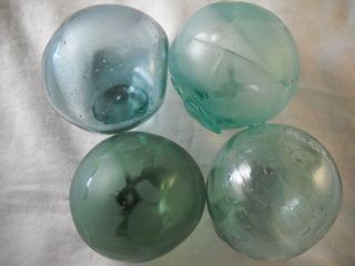 4 Vintage Japanese Odd Shaped And Dented Glass Floats Alaska Beach Combed photo