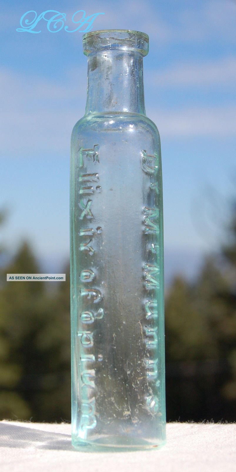 Classic Antique Opium Based Pain Killer Patent Quack Medicine Bottle Quack Medicine photo