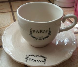 Ceramic Cup And Saucer.  - Reads Paris.  Vintage? photo