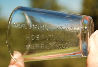 Antique Odd Inside Embossed Metropolitan Hospital Supply Co Medicine Dose Glass photo