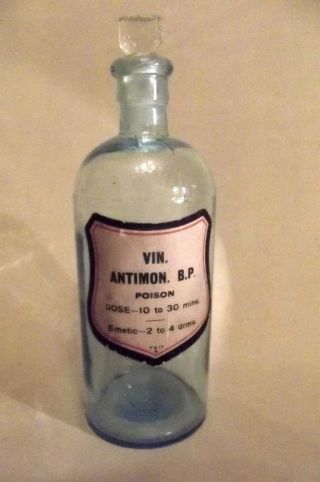 Pharmacy Bottle,  Antique,  ' Vin.  Antimon B.  P.  ',  Paper Label,  Stopper, photo