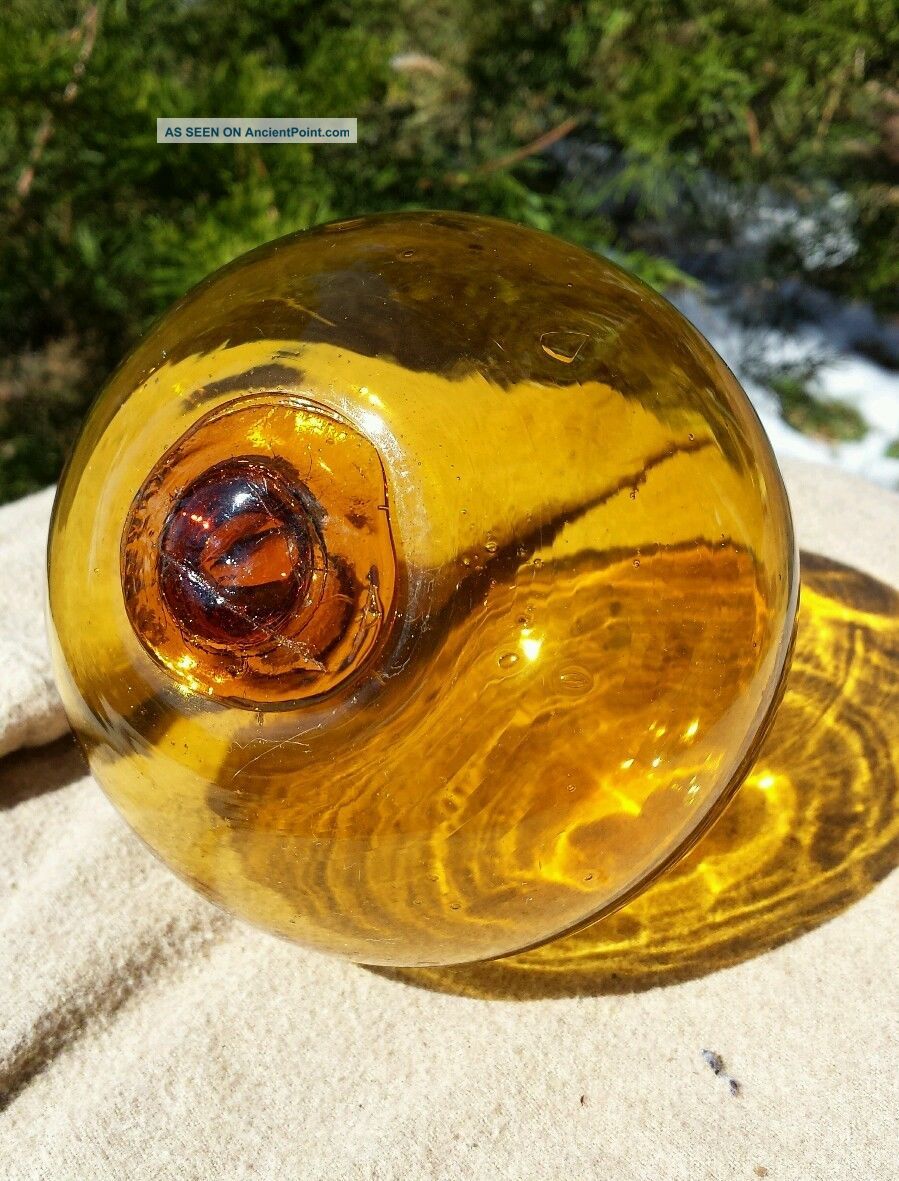 http://ancientpoint.com/imgs/a/i/t/k/s/japanese_hand_blown_glass_fishing_net_floats_old_vtg_buoy_amber_12__1_lgw.jpg