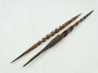 2 Antique Papuan Hand Carved Spear Points Orchid Stem Binding Ocre Paints Png photo