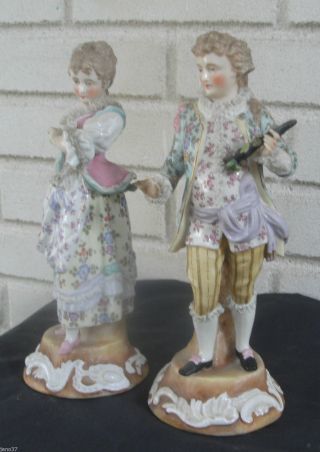 Captivating Pair Antique Figures Man & Woman Lace Trim,  Pedestal Bases photo